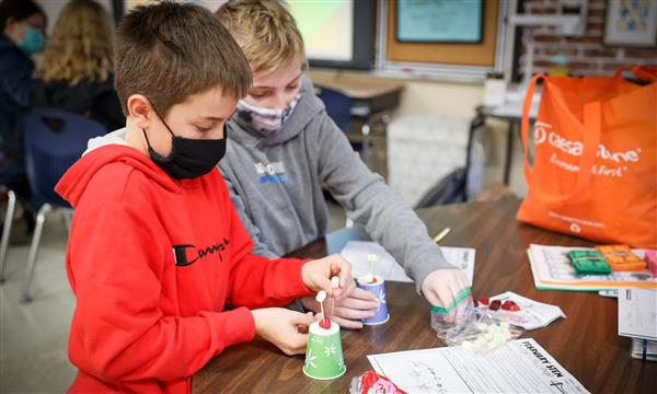 students work to build a bridge